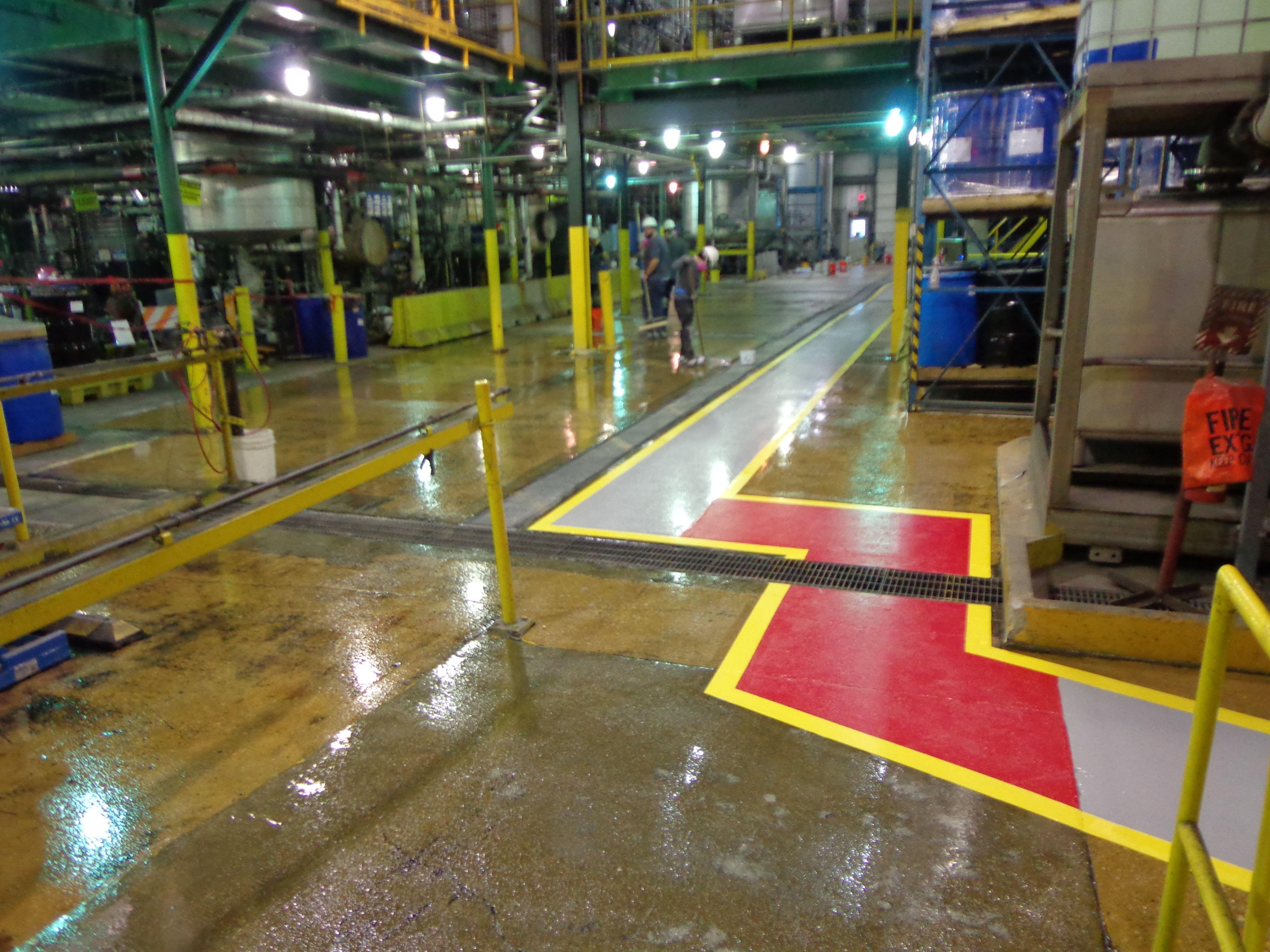 red grey and yellow walk aisle in chemical facility