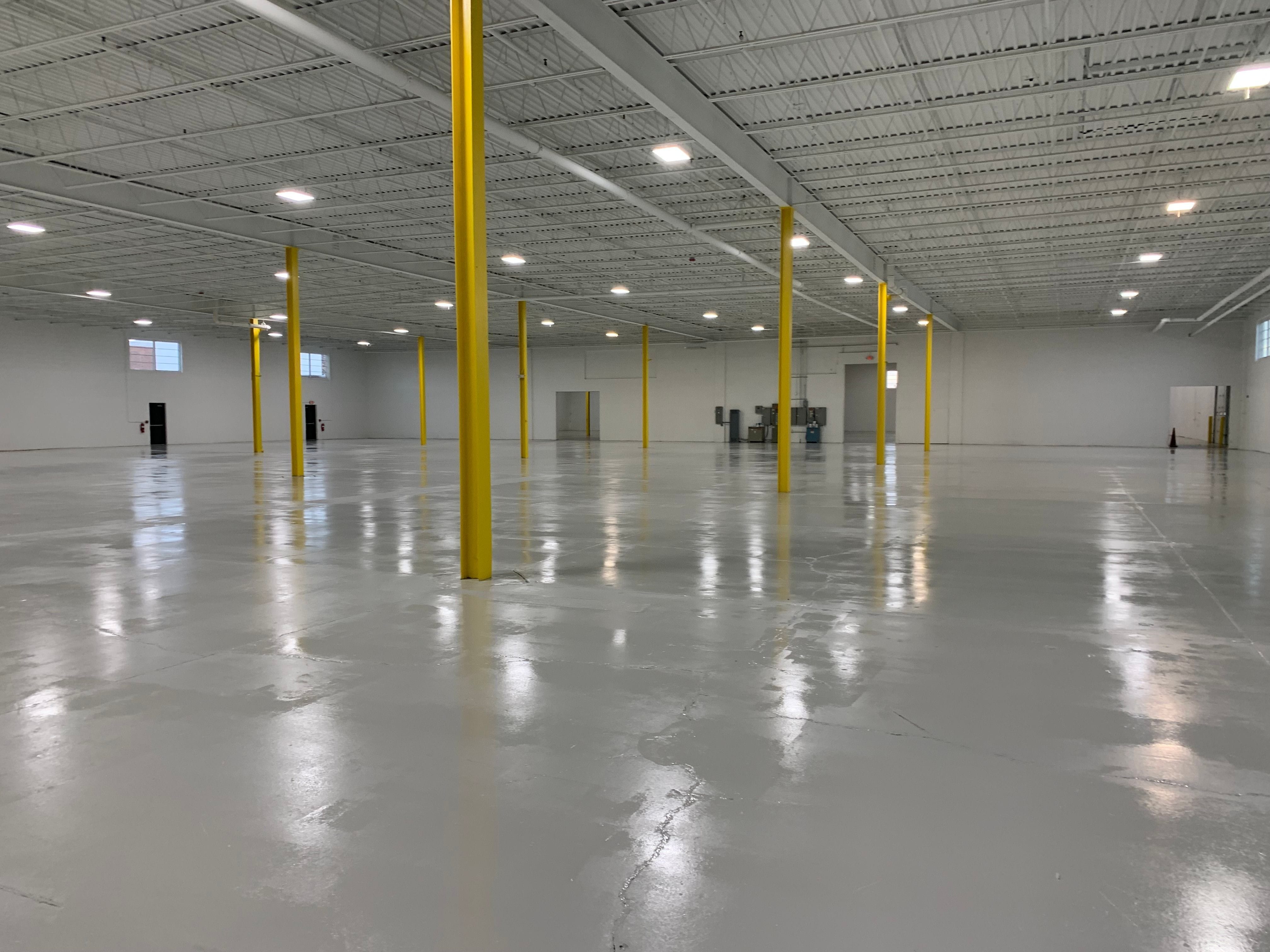 Grey epoxy coating installed on a warehouse floor