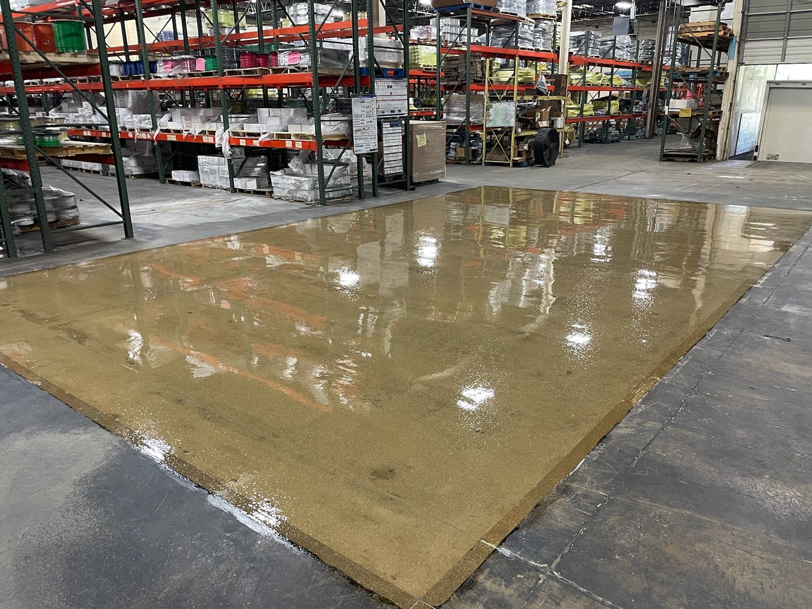 Concrete resurfacing in an occupuied warehouse
