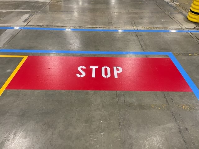 designated stop area in drive aisle
