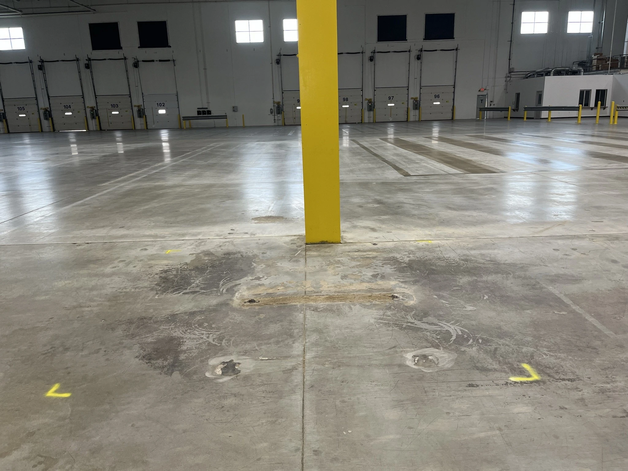 acid damage on a warehouse floor