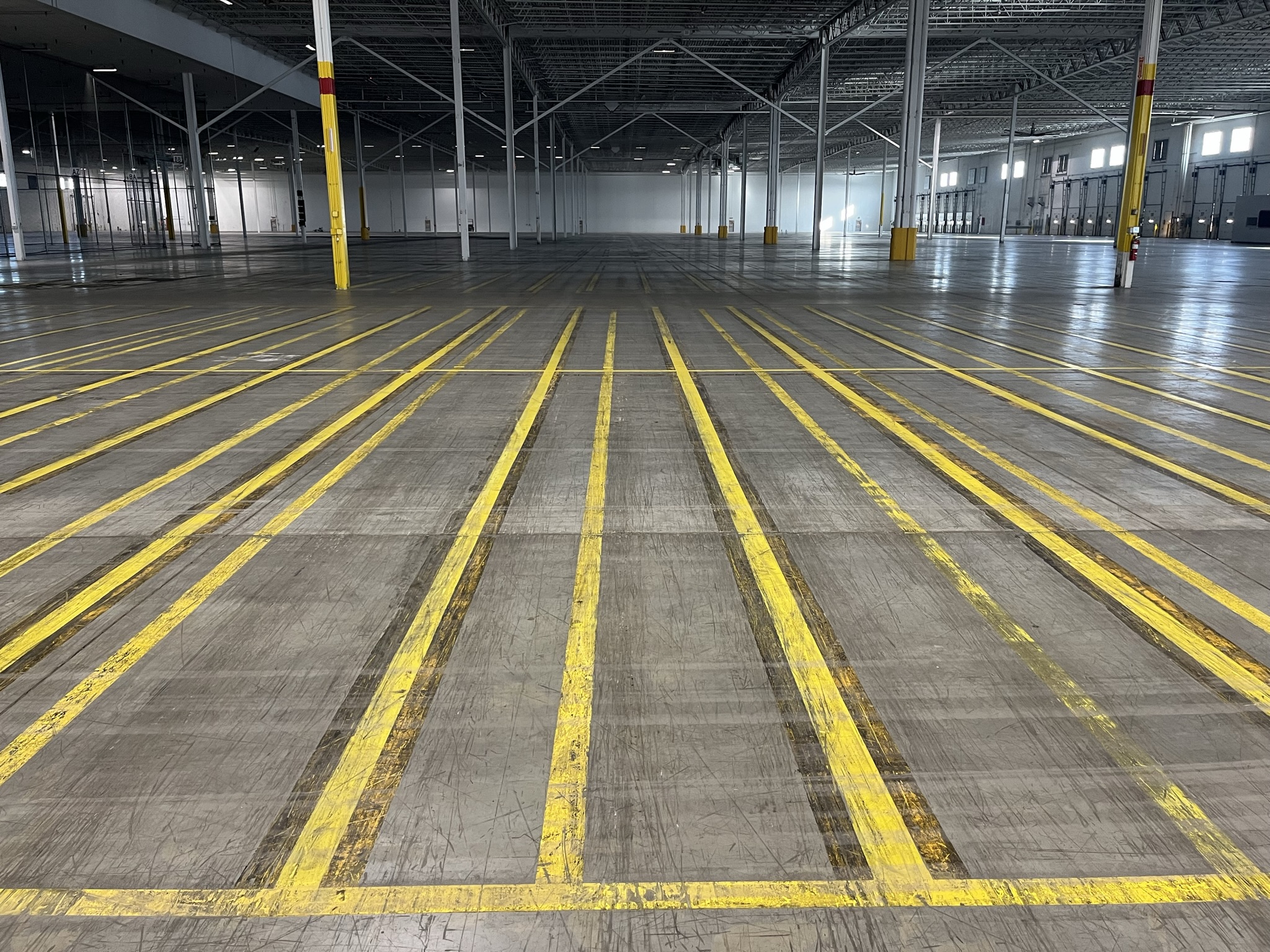 Worn out line markings on a warehouse floor